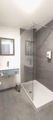 a bathroom with a shower with a glass door at Estación de Montaña Manzaneda, Ciudad de Lugo, 114 in Ourense