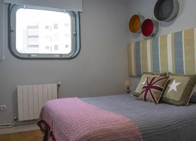 a bedroom with a bed and a window at Estación de Montaña Manzaneda, Ciudad de Lugo, 114 in Ourense