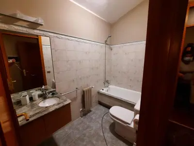 a bathroom with a toilet and a sink and a tub at Casa rural en entorno privilegiado in Valongo
