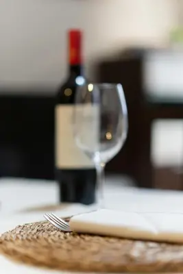 a bottle of wine and a wine glass on a table at ***** Solaina das Burgas ***** en el Casco Viejo in Ourense