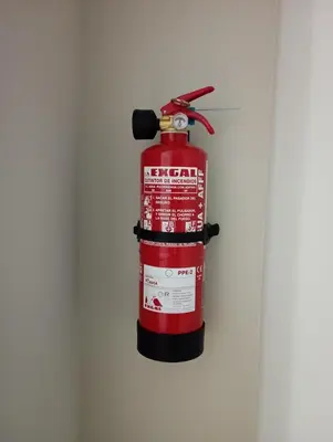 a fire extinguisher hanging on a wall at ***** Solaina das Burgas ***** en el Casco Viejo in Ourense