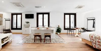 a bedroom with a bed and a sink in a room at Casa Miño in Ourense