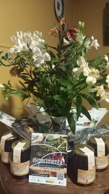 a vase of flowers sitting on top of a table at A Casa das Augas in Mondoñedo