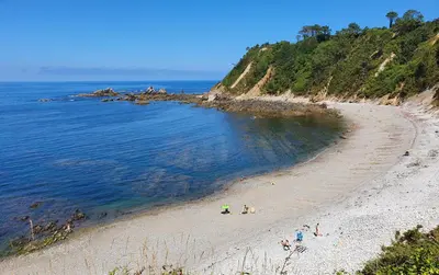 a group of people on a beach near the ocean at Casa Arquella in Cartavio