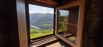 a window with a view of a mountain at Mirador del Navia in Serandinas