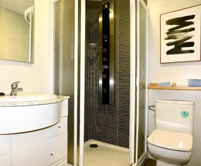 a bathroom with a shower and a toilet and a sink at Rías Altas Home Sada in Sada
