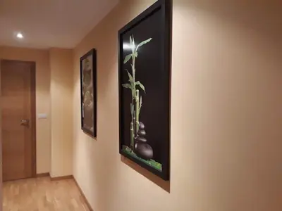 a picture of a plant on a wall at Rías Altas Home Sada in Sada