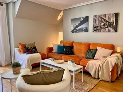 a living room with a couch and a table at Rías Altas Home Sada in Sada
