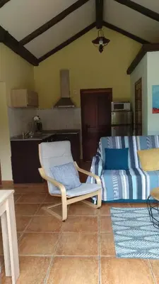 a living room with a chair and a couch at O Pedregal in Burela de Cabo