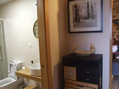a bathroom with a sink and a toilet and a sink at Rincón del Viso in Ourense