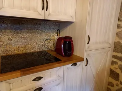 a red appliance sitting on a counter in a kitchen at Rincón del Viso in Ourense