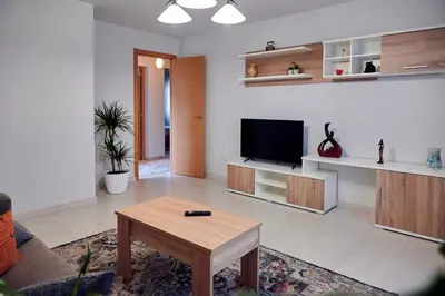 a living room with a tv and a coffee table at Casa Costal in Mondariz