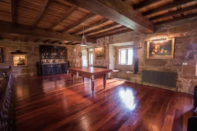 a large room with a table in the middle of it at Pazo del siglo XVII en el corazón de Galicia in Lalín