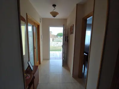 a hallway of a house with a hallway leading to a door at Casa Aroa in Barreiros
