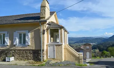 an old stone house with a turret at Apartamentos Minas de Silvarosa in Viveiro