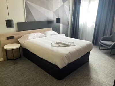 a hotel room with a bed with a tray on it at Area 507 in Outeiro de Rei