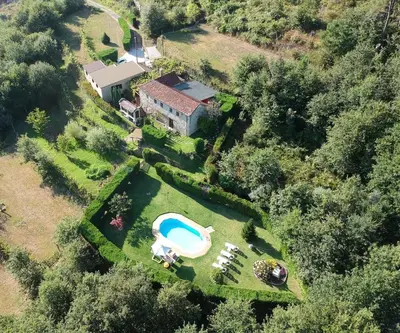 an aerial view of a house with a swimming pool at Casa rural O CARBALLO DA PEDRA in La Cañiza