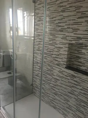 a bathroom with a glass shower and a toilet at A boa vista in Melide