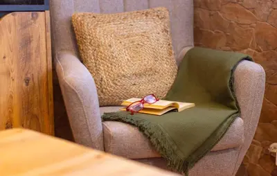 a gold book sitting on a chair in a room at 