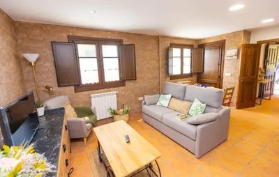 a living room with a couch and a table at 