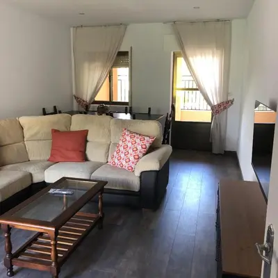 a living room with a couch and a coffee table at El Mirador de la Villa in Puebla de Sanabria
