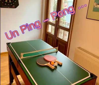 a ping pong table with a ping paddle on it at FANTASTICO APARTAMENTO EN RIBADEO in Ribadeo