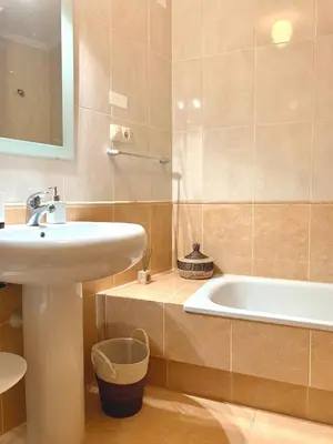 a bathroom with a sink and a bath tub at FANTASTICO APARTAMENTO EN RIBADEO in Ribadeo