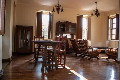 a dining room with a table and chairs at Casa con finca en Pol, Monforte de Lemos in Monforte de Lemos