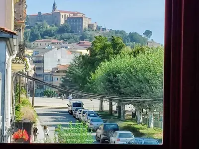 a view of a city street with cars parked at La Casita de la Ribeira Sacra in Monforte de Lemos