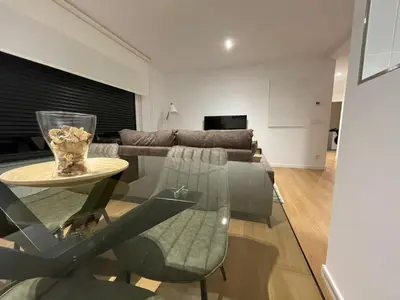 a living room with a couch and a glass table at Oktheway Areal in Oleiros
