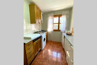 a hotel room with two beds and a window at Casa rural: Villa Marías in Sampil