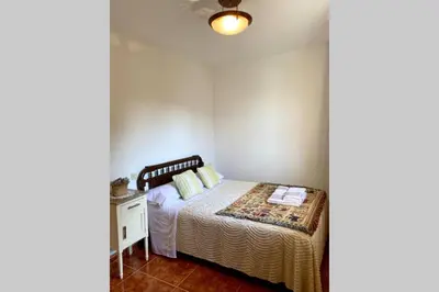 a bedroom with a bed and a window at Casa rural: Villa Marías in Sampil