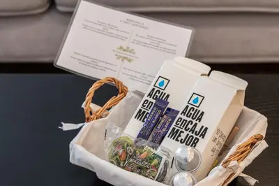 a bag of food and a card on a table at I Loft Santiago by Upper Luxury Housing in Santiago de Compostela