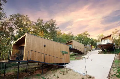 a group of modular homes in a park at Cabanas Mirador Cachamuíña in Ourense