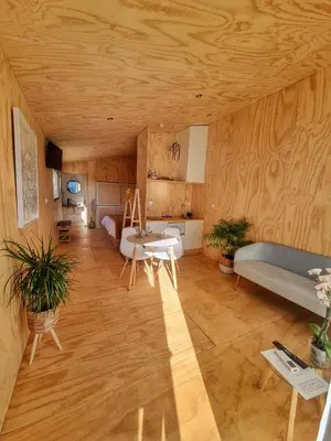 a living room with a couch and a table at Cabanas Mirador Cachamuíña in Ourense