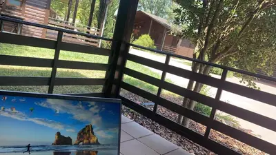 a view from a window of a fence with a picture at Cabañas bungalow, El Bosque de los Sueños in Cubillos del Sil