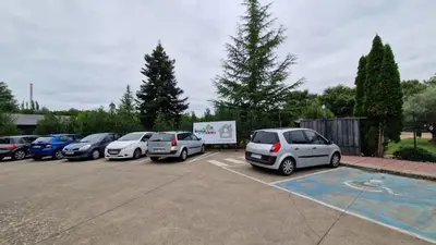 a row of cars parked in a parking lot at Cabañas bungalow, El Bosque de los Sueños in Cubillos del Sil
