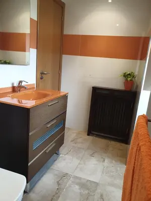 a bathroom with a sink and a toilet at Villa Rosa in Silleda
