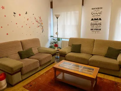 a living room with two couches and a coffee table at CERCA DE TODO in Santiago de Compostela