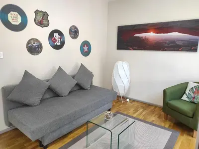 a living room with a couch and a chair at Catedral Centro Histórico in Ourense