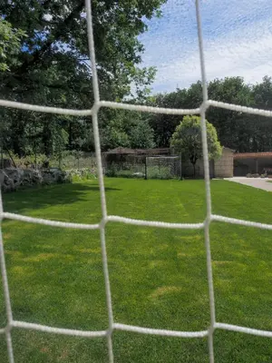 a view of a soccer field from behind a net at Espectacular Casa con Piscina en Allariz in Allariz
