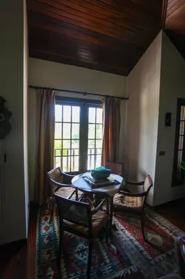 a living room with a table and chairs and a window at Espectacular Casa con Piscina en Allariz in Allariz