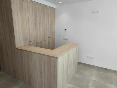 a large wooden cabinet in a room with a tile floor at A Pousa do Asma in Chantada