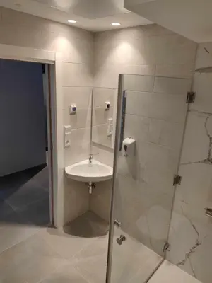 a bathroom with a sink and a shower at A Pousa do Asma in Chantada