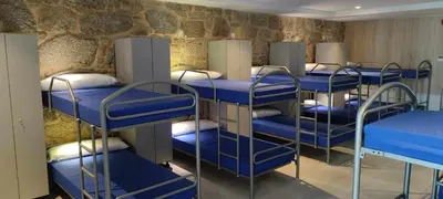 a group of bunk beds in a room at A Pousa do Asma in Chantada