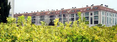 a large building with a lot of windows at Apartamentos LÓRIEN Milladoiro in Milladoiro