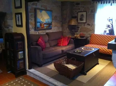 a living room with a couch and a table at Casa das Augas Santas in Aguas Santas