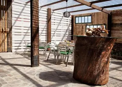 a patio with a table and chairs in a building at Casa Don Din in Cruces