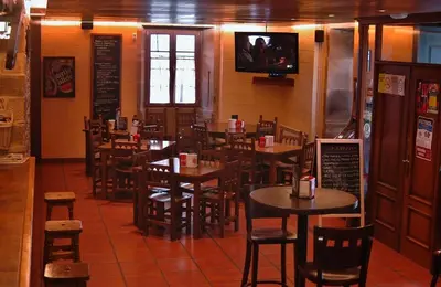 a dining room with tables and chairs in a restaurant at Casa Don Din in Cruces