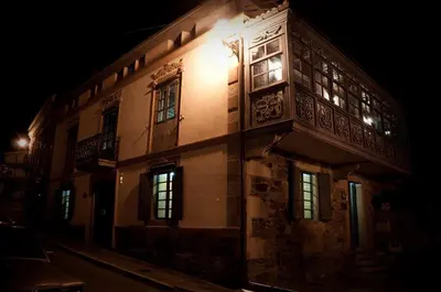 a building at night with lights on it at Casa Don Din in Cruces